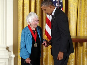 FILE - In this July 28, 2014 file photo President Barack Obama awards the 2013 National Humanities Medal to historian Anne Firor Scott from Chapel Hill, N.C., during a ceremony in the East Room at the White House in Washington. Anne Firor Scott, a prize-winning historian and esteemed professor who upended the male-dominated field of Southern scholarship by pioneering the study of Southern women, has died. She was 97. Her death was announced last week by Duke University, where she taught for three decades. The citation for her humanities medal praised her "groundbreaking research spanning ideology, race, and class."