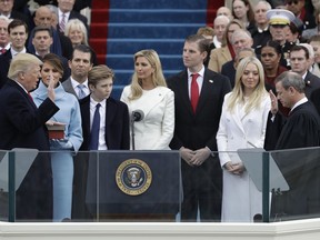 FILE - In this Jan. 20, 2017 file photo, Donald Trump, left, is sworn in as the 45th president of the United States by Chief Justice John Roberts, right, as Melania Trump, second left, and his family watch during the 58th Presidential Inauguration at the U.S. Capitol in Washington. A federal subpoena seeking documents from Donald Trump's inaugural committee is part of "a hysteria" over the fact that he's president, White House press secretary Sarah Sanders said on Tuesday, Feb. 5, 2019. Federal prosecutors in New York issued the subpoena on Monday, furthering a federal inquiry into a fund that has faced mounting scrutiny into how it raised and spent its money.