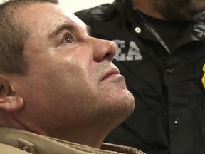 FILE- In this Jan. 19, 2017 file photo provided by the United States Drug Enforcement Administration, Mexican drug kingpin Joaquin "El Chapo" Guzman arrives at Long Island MacArthur Airport in Ronkonkoma, N.Y., after being extradited to the United States to face drug trafficking charges. Questions as to whether Guzman received a fair trial arose after a VICE News report in February 2019 said several jurors followed media accounts of the three month-long trial. (United States Drug Enforcement Administration via AP)