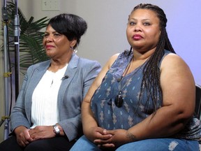 FILE - In this June 7, 2018 file photo, Alice Marie Johnson, left, and her daughter Katina Marie Scales wait to start a TV interview on in Memphis, Tenn. Johnson, an inmate whose life sentence was commuted thanks in part to the efforts of Kim Kardashian West, now has a book deal, along with a deal for film and television rights. Harper, an imprint of HarperCollins Publishers, announced Wednesday, Feb. 6, 2019, that Johnson's "After Life: My Journey From Incarceration to Freedom" comes out May 21.