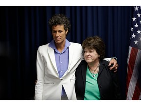 FILE - In this Thursday, April 26, 2018, file photo, Bill Cosby accuser Andrea Constand, left, and her attorney Dolores Troiani listen during a news conference after Cosby was found guilty in his sexual assault trial, in Norristown, Pa. Constand's defamation lawsuit against former prosecutor Bruce Castor has been settled. Troiani said Thursday, Jan. 31, 2019, that the terms are confidential and both sides agreed not to comment.