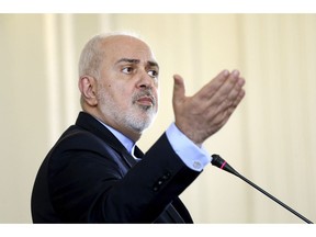File-This Feb. 13, 2019, file photo shows  Iranian Foreign Minister Mohammad Javad Zarif speaking at a news conference in Tehran, Iran. Zarif suddenly resigned late Monday, Feb. 25, 2019, without warning, offering an "apology" to the nation as the nuclear deal he negotiated with world powers stands on the verge of collapse after the U.S. withdrew from the accord.