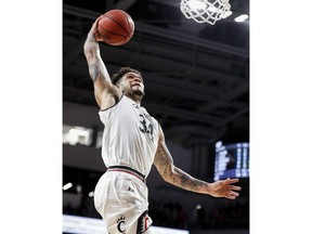 Cincinnati guard Jarron Cumberland dunks during the first half of the team's NCAA college basketball game against Central Florida, Thursday, Feb. 21, 2019, in Cincinnati.