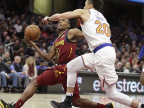 Cleveland Cavaliers' Collin Sexton (2) drives to the basket against New York Knicks' Kevin Knox (20) in the first half of an NBA basketball game, Monday, Feb. 11, 2019, in Cleveland.