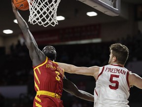 Iowa State guard Marial Shayok (3) goes up for a basket as Oklahoma forward Matt Freeman (5) defends in the first half of an NCAA college basketball game in Norman, Okla., Monday, Feb. 4, 2019.