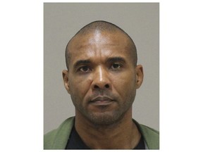 In this photo provided by the Kent County Michigan Sheriff's office, Cedric Marks is pictured in a booking photo in Grand Rapids, Mich., dated Jan. 8, 2019. The Montgomery County Texas Sheriff's Office say Marks, facing three "pending murder charges", has escaped from a private prisoner transport in Conroe, Texas, and is considered "extremely dangerous." (Kent County Michigan Sheriff's Office via AP)