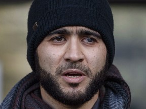 Omar Khadr speaks outside court in Edmonton on Thursday, December 13, 2018. Khadr is asking Alberta youth court to order his release and declare his eight-year sentence — imposed by a widely maligned military commission in the United States — to have expired.