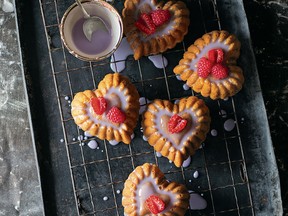 Orange yogurt hearts with violet glaze and raspberries