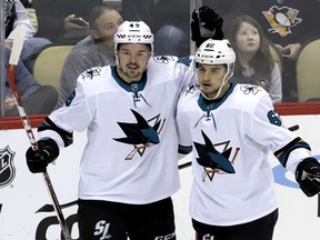 San Jose Sharks' Tomas Hertl (48) celebrates his second goal of the first period with Kevin Labanc (62) during an NHL hockey game against the Pittsburgh Penguins in Pittsburgh, Thursday, Feb. 21, 2019.