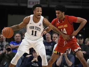 Penn State forward Lamar Stevens (11) tries to get past Maryland forward Ricky Lindo Jr., (14) during the first half of an NCAA college basketball game Wednesday, Feb. 27, 2019, in State College, Pa.