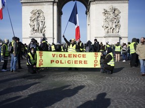 Yellow vest protesters gather at the Arc de Triomphe.