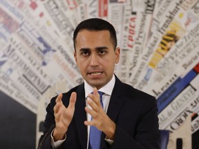 FILE - In this Nov.9, 2018 file photo, Italian deputy Premier and Labor Minister Luigi Di Maio talks to reporters during a press conference at the Foreign Press Association headquarters, in Rome. France is recalling its ambassador to Italy amid mounting tensions, after Di Maio met with French yellow vest protesters and offered to support their anti-government movement.