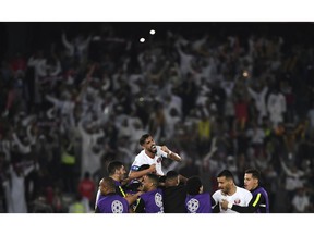 Players of Qatar celebrate their sides second goal scored by midfielder Abdelaziz Hatim during the AFC Asian Cup final match between Japan and Qatar in Zayed Sport City in Abu Dhabi, United Arab Emirates, Friday, Feb. 1, 2019.
