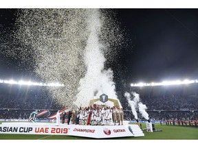 Qatar's team celebrates after winning the AFC Asian Cup final match between Japan and Qatar in Zayed Sport City in Abu Dhabi, United Arab Emirates, Friday, Feb. 1, 2019.