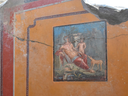 The atrium of a house with a fresco portraying the mythological hunter Narcissus in Pompeii, near Naples, Italy.