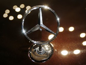 FILE - In this Feb. 5, 2015 file photo the logo of a Mercedes car is photographed during an annual press conference of Daimler AG in Stuttgart, Germany. Daimler hat its annual press conference on Wednesday.