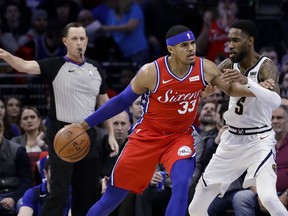 Philadelphia 76ers' Tobias Harris (33) drives to the basket against Denver Nuggets' Will Barton (5) during the first half of an NBA basketball game Friday, Feb. 8, 2019, in Philadelphia.