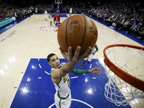 Boston Celtics' Jayson Tatum goes up for a shot during the first half of an NBA basketball game against the Philadelphia 76ers, Tuesday, Feb. 12, 2019, in Philadelphia.