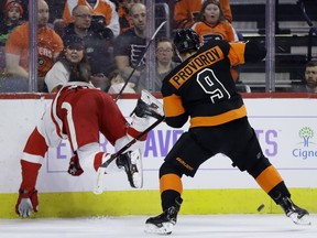 Detroit Red Wings' Justin Abdelkader, left, goes flying after trying to check Philadelphia Flyers' Ivan Provorov during the first period of an NHL hockey game, Saturday, Feb. 16, 2019, in Philadelphia.