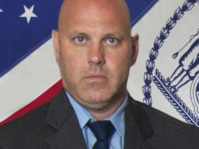 In this undated photo provided by the New York City Police Department, Det. Brian Simonsen is shown.