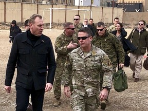 Acting Defense Secretary Pat Shanahan, left, arrives in Kabul, Afghanistan, Monday morning, Feb. 11, 2019, to consult with Army Gen. Scott Miller, right, commander of U.S. and coalition forces, and senior Afghan government leaders. The unannounced visit is the first for the acting secretary of defense, Pat Shanahan. He previously was the No. 2 official under Jim Mattis, who resigned as defense chief in December.