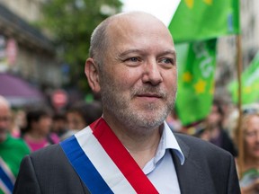 In this picture taken on Sept. 21, 2014, Denis Baupin, a prominent Green Party member and former Paris city official, takes part in a climate change demonstration in Paris, France. Baupin's defamation lawsuit against six women who accused him of sexual misconduct and four journalists who reported the allegations,  goes to trial Monday Feb. 4, 2019, in what some fear illustrates a backlash against the #MeToo movement. (AP Photo)