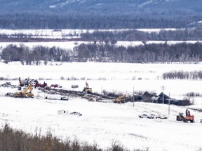 Excavators work at the site of a train derailment ten-kilometres south of St. Lazare, Man. on Saturday February 16, 2019. A train carrying oil has derailed and is leaking in western Manitoba. Canadian National Railway says in a statement that 37 cars carrying crude left the tracks early Saturday morning near St-Lazare, just east of the Saskatchewan-Manitoba boundary.