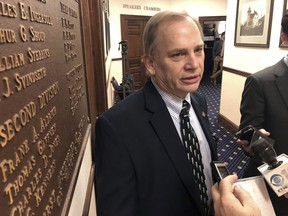 Alaska state Rep. Mark Neuman speaks to reporters after efforts to elect a permanent speaker failed on the House floor on Tuesday, Feb. 12, 2019, in Juneau, Alaska. Neuman was among those who thought Rep. Gary Knopp would support Rep. Dave Talerico as speaker.