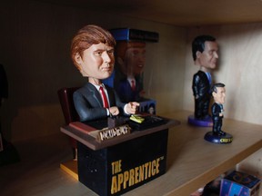 In this Jan. 8, 2019 photo, a bobblehead depicting Donald Trump from the TV show "The Apprentice," which says "You're fired" upon the press of a button is on display at the National Bobblehead Hall of Fame and Museum in Milwaukee. The new museum will be displaying more than 6,500 figures of athletes, mascots, celebrities, animals, cartoon characters, politicians and more.