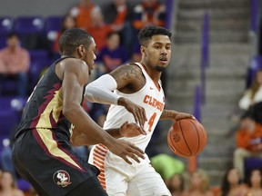 Clemson's Shelton Mitchell, right, drives against Florida State's Trent Forrest, left, during the first half of an NCAA college basketball game Tuesday, Feb. 19, 2019, in Clemson, S.C.