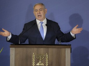 FILE - In this Feb. 21, 2018 file photo, Israeli Prime Minister Benjamin Netanyahu speaks during the Conference of Presidents of Major American Jewish Organizations in Jerusalem. A Mideast conference, which begins Wednesday, Feb. 13, 2019, in Poland offers Netanyahu an opportunity to flaunt in public what he has long boasted about happening behind the scenes -- his country's improved relations with Arab countries. Several Gulf dignitaries are expected to attend in a potential show of force against uninvited Iran.