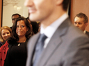 Prime Minister Justin Trudeau arrives to announce his shuffled cabinet in January, watched by Jody Wilson-Raybould who has recently resigned.