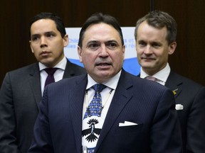 Perry Bellegarde, AFN National Chief speaks as Indigenous Services Minister, Seamus O'Regan, and Natan Obed, president of Inuit Tapiriit Kanatami, look on at press conference regarding the introduction of Bill C-92, An Act respecting First Nations, Inuit and Metis children, youth and families in Ottawa on Thursday, Feb. 28, 2019.