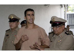 Detained Bahraini soccer player Hakeem al-Araibi arrives at the criminal court in Bangkok, Thailand Monday, Feb. 4, 2019. Al-Araibi has said he fled his home country due to political repression and human rights groups and activists fear he risks torture if he is sent back. Bahrain wants him returned to serve a 10-year prison sentence he received in absentia in 2014 for vandalizing a police station, which he denies.