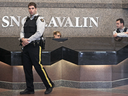 RCMP officers guard the lobby of the SNC-Lavalin head office in Montreal as a raid is carried out the company, April 13, 2012.