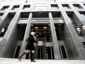 A pedestrian walks past the SNC-Lavalin Group Inc. headquarters in Montreal on Feb. 12, 2019.