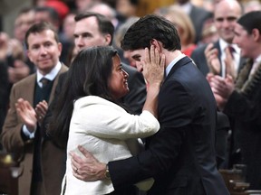 Prime Minister Justin Trudeau is embraced by Jody Wilson-Raybould after delivering a speech on the recognition and implementation of Indigenous rights in in the House of Commons on Parliament Hill in Ottawa on Wednesday, Feb. 14, 2018.