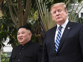 U.S. President Donald Trump walks with North Korea's leader Kim Jong Un during a break in talks at the second U.S.-North Korea summit in Hanoi, Feb. 28, 2019.