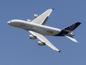 FILE - In this June 26, 2011, file photo, an Airbus A380 performs during a demonstration flight at the 49th Paris Air Show at Le Bourget airport, east of Paris. Airbus said Thursday, Feb. 14, 2019 it will stop making A380 superjumbo jets in 2021 after struggling to win clients.