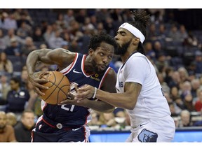 Los Angeles Clippers guard Patrick Beverley (21) handles the ball against Memphis Grizzlies guard Mike Conley (11) in the first half of an NBA basketball game Friday, Feb. 22, 2019, in Memphis, Tenn.