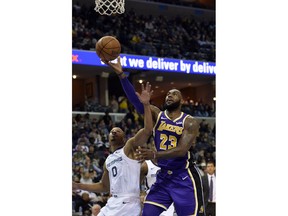 Los Angeles Lakers forward LeBron James (23) shoots against Memphis Grizzlies guard Avery Bradley (0) in the first half of an NBA basketball game Monday, Feb. 25, 2019, in Memphis, Tenn.