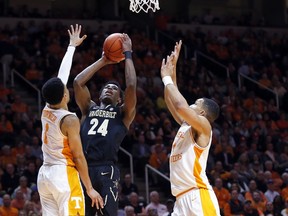 Vanderbilt forward Aaron Nesmith (24) shoots as he's defended by Tennessee guard Lamonte Turner (1) and forward Grant Williams (2) during the first half of an NCAA college basketball game Tuesday, Feb. 19, 2019, in Knoxville, Tenn.