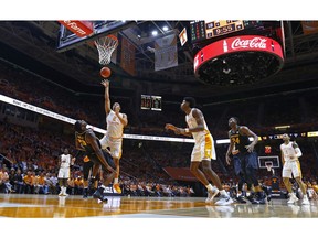 Tennessee forward Grant Williams (2) shoots as he collides with Missouri forward Jeremiah Tilmon (23) during the first half of an NCAA college basketball game Tuesday, Feb. 5, 2019, in Knoxville, Tenn.