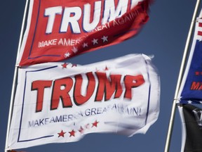 Flags fly outside a rally for U.S. President Donald Trump in El Paso, Texas, U.S., on Monday, Feb. 11, 2019.