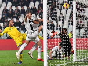 Juventus's Leonardo Bonucci, 2nd left, scores during the Serie A soccer match between Juventus and Frosinone at the Allianz Stadium in Turin, Italy,  Friday, Feb. 15, 2019.