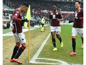 Torino's Armando Izzo, left, celebrates with his teammates after scoring during the Italian Serie A soccer match between Torino and Atalanta in Turin, Italy, Saturday, Feb. 23, 2019.
