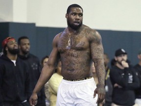 FILE - In this March 16, 2016, file photo, Shawn Oakman pauses during drills for NFL scouts at Baylor's Pro Day football workout in Waco, Texas. Prosecutors in Texas have rested their case in the trial of  the former Baylor University football player accused of raping another student in 2016. The prosecution rested Thursday, Feb. 28, 2019, just a day after opening statements in the trial. Oakman's attorney contend the two had consensual sex.