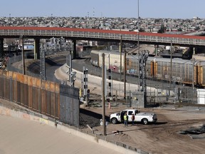In this Tuesday, Jan. 22, 2019, photo, a new barrier is built along the Texas-Mexico border near downtown El Paso. Such barriers have been a part of El Paso for decades and are currently being expanded, even as the fight over President Donald Trump's desire to wall off the entire U.S.-Mexico border.