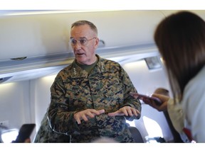 Joint Chiefs Chairman Gen. Joseph Dunford gestures while speaking to reporters during a briefing on a military aircraft before arrival at El Paso International airport, Saturday, Feb. 23, 2019. Dunford is traveling with Acting Secretary of Defense Patrick Shanahan and they are planning to pay a visit to Texas-Mexico border.