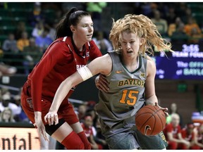 Texas Tech forward Brittany Brewer (20) defends as Baylor forward Lauren Cox (15) makes a move to the basket for a shot in the second half of an NCAA college basketball game in Waco, Texas, Saturday, Feb. 2, 2019.